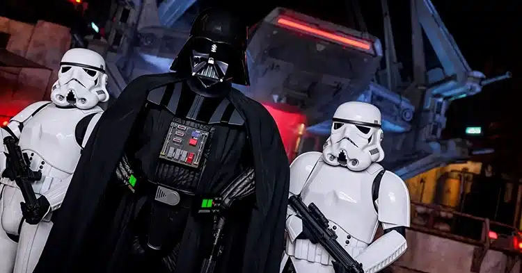A close-up shot of a Darth Vader and two Stormtroopers in Star Wars: Galaxy’s Edge at Disneyland, representing the character additions that break the land’s original timeline.